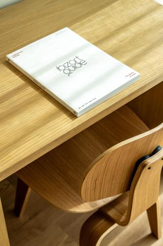 a book sitting on top of a wooden table at Ocean Drive Sevilla in Seville