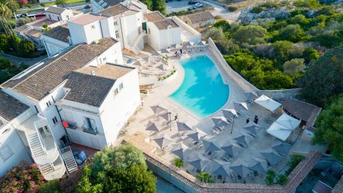 an aerial view of a house with a swimming pool at Grand Hotel Villa Politi in Siracusa