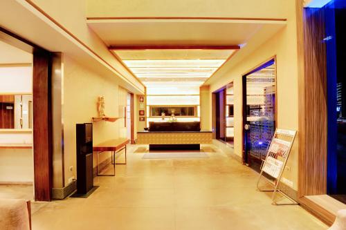 a hallway of a building with a waiting room at SANKAMA The Boutique Hotel in Dāvangere