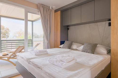 Posteľ alebo postele v izbe v ubytovaní Elements Camping Selce Mobile homes