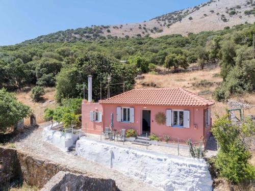 a house in the middle of a mountain at Villa Spirida at Drakopoulata in Ayia Evfimia