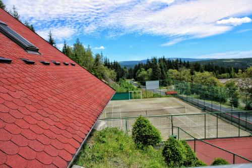 an overhead view of a tennis court with a red roof at Pension H in Jáchymov
