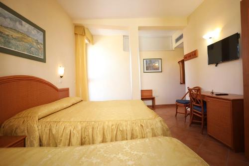 Postel nebo postele na pokoji v ubytování Hotel Katy