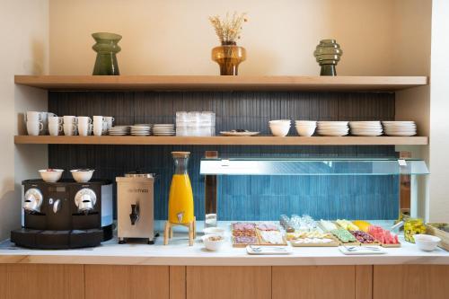 a kitchen with a counter with food on it at Ocean Drive Sevilla in Seville