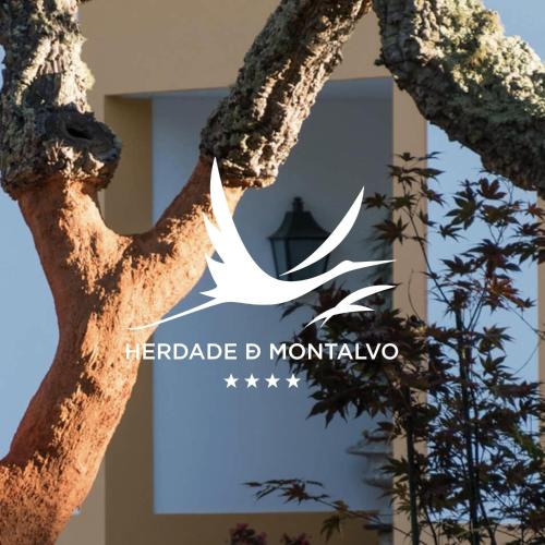 a white bird flying through the branches of a tree at Herdade de Montalvo - Comporta in Comporta