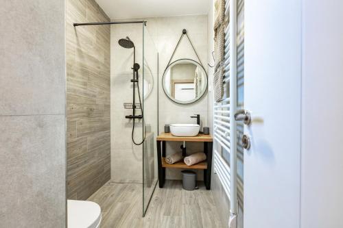 a bathroom with a shower and a sink at Villa THALIA in Tisno