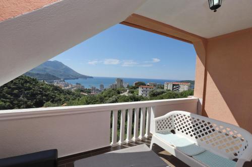 a balcony with a view of the ocean at Apartmani Amra in Ivanovići