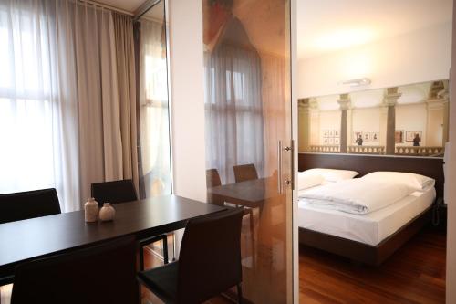 Postel nebo postele na pokoji v ubytování arte Hotel Linz