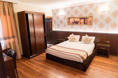 Ένα ή περισσότερα κρεβάτια σε δωμάτιο στο BL-Hotels Erbil