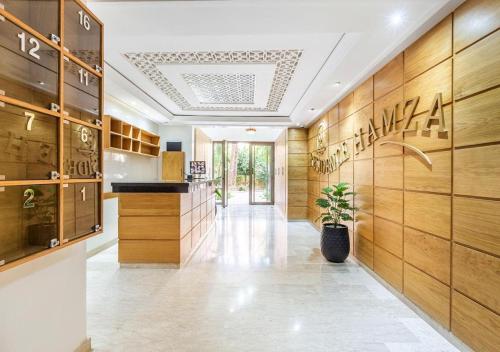 a hallway of a store with wooden walls at TheCasaEdition - Gueliz Residency in Marrakech