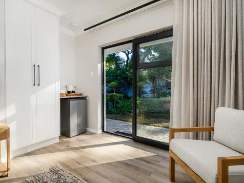 a living room with a sliding glass door at Nadora's Rest in Kirkwood