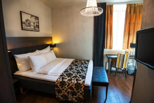Postel nebo postele na pokoji v ubytování Banken Hotel