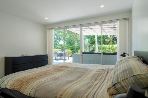 a bedroom with a large bed and a large window at Exclusive beach apartment with Wonderful View in Ko Lanta