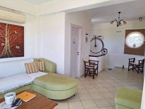 a living room with a couch and a table at Villa Tapia in Methoni