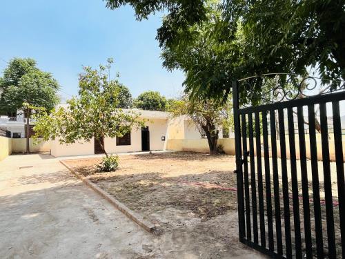 a black gate in front of a house at Comfort Homes in Panchkula