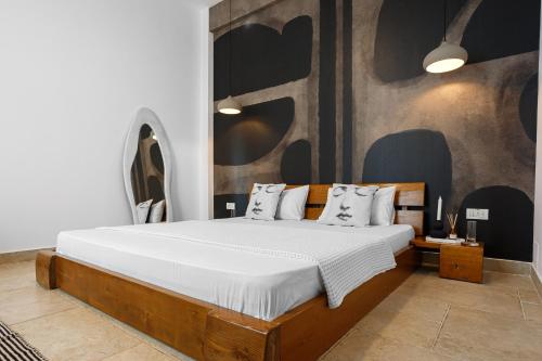 a bedroom with a bed with white sheets and pillows at Zen Vama Veche in Vama Veche