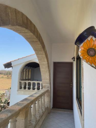 a hallway of a house with a door and a sunflower at Villa Salentina in Sant'Isidoro