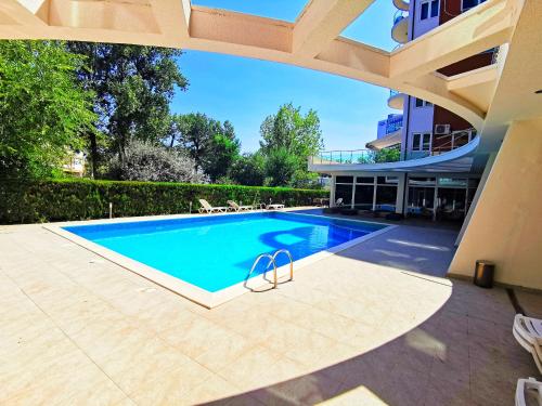 a swimming pool in the backyard of a house at Luisa Lux Apartment - Sat Vacanta in Mamaia