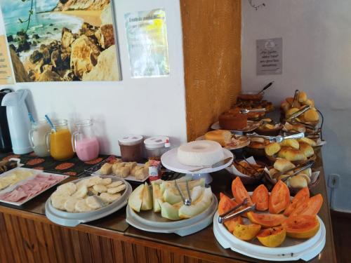 a buffet with a bunch of different types of food at Pousada João Maria in Trancoso