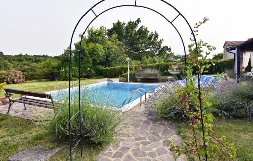 an archway over a swimming pool in a yard at Vila Vesna in Grožnjan