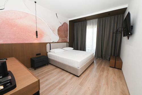 Postel nebo postele na pokoji v ubytování Monun Hotel