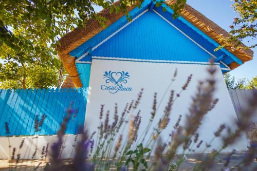 a blue building with the cecilium sign on it at Casa Ilinca in Jurilovca