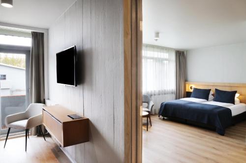 Postel nebo postele na pokoji v ubytování Fosshotel Reykholt