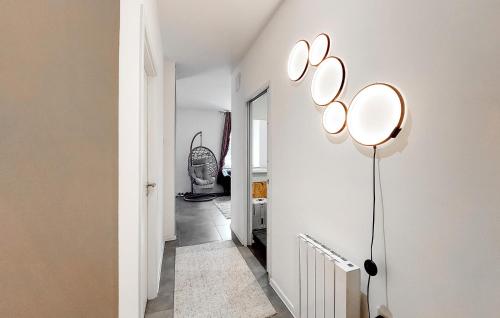 a hallway with white walls and a light fixture at Gorgeous Apartment In Le Thillot in Le Thillot