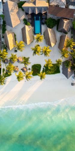 an aerial view of a resort on a beach at Savera Beach Houses in Jambiani