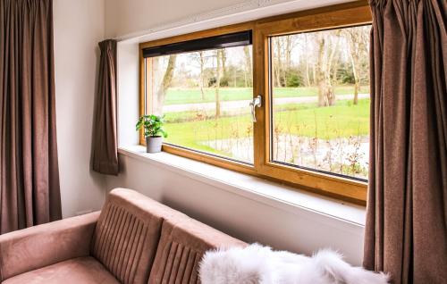 a living room with a window and a couch at Stunning Home In Ijhorst With Wifi in IJhorst