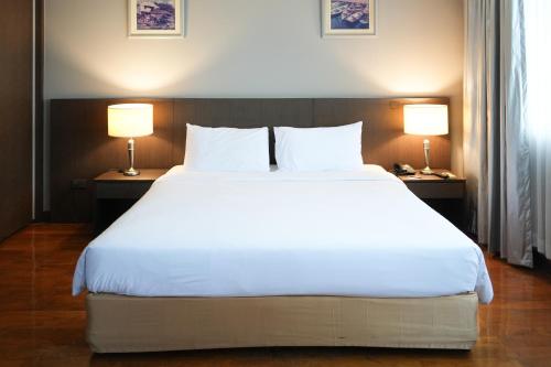 Katil atau katil-katil dalam bilik di Royal Suite Hotel Bangkok
