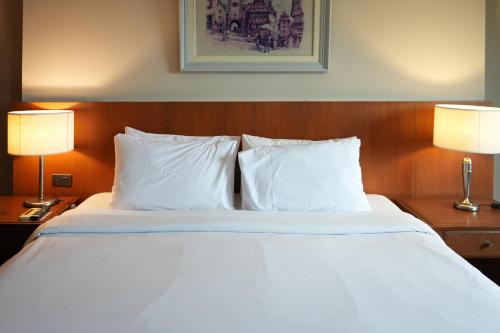 Katil atau katil-katil dalam bilik di Royal Suite Hotel Bangkok
