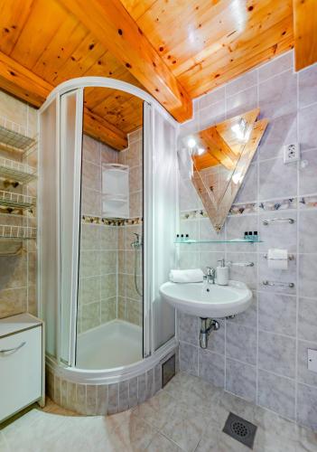 a bathroom with a shower and a sink at Seaside Apartments Bol in Bol