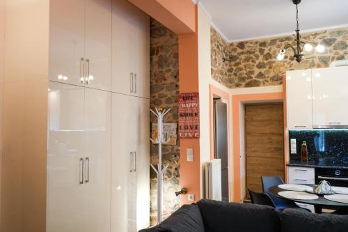 a living room with a couch and a table at Φιλόξενο Σπίτι in Nafplio