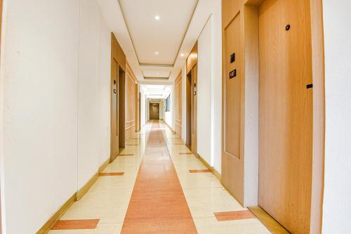 an empty corridor of an office building with a long hallway at Hotel Supreme - 700M From Vasco Da Gama Railway Station in Marmagao