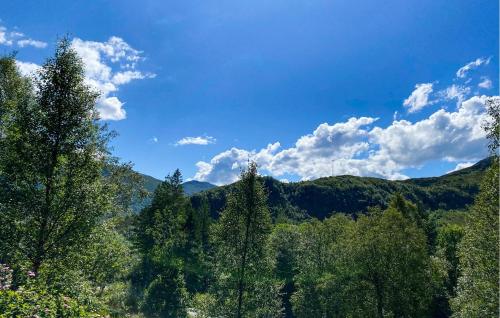 a view of a forest of trees and mountains at 2 Bedroom Pet Friendly Home In Haddal in Haddal