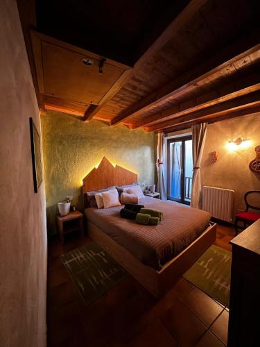 a bedroom with a large bed in a room at Maison I Love Mont Blanc in Courmayeur