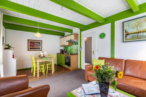 a living room with a couch and a table at Atlanta Pur in Pellworm