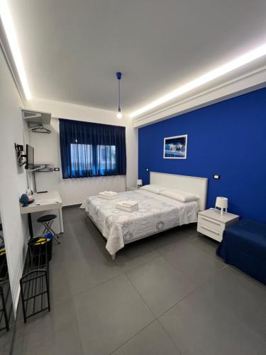 A bed or beds in a room at Sicilia Bedda B&B