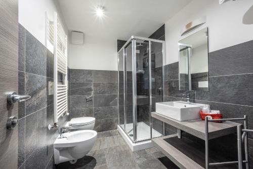 a bathroom with a sink and a toilet and a shower at Monte Emilius in Aosta