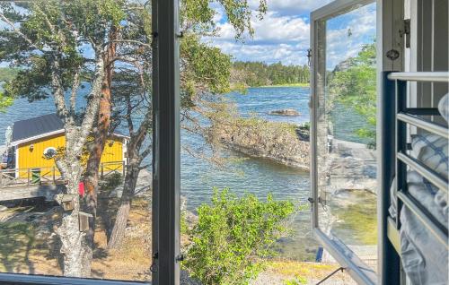 a view of a river from a window at 4 Bedroom Amazing Home In Sorunda in Hästnäs