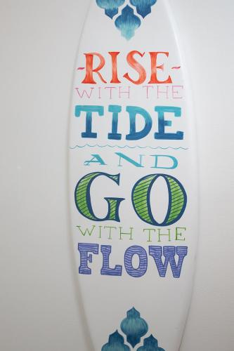 a tie that says rise with the tide and go with the flow at The Surf Shack in Destin
