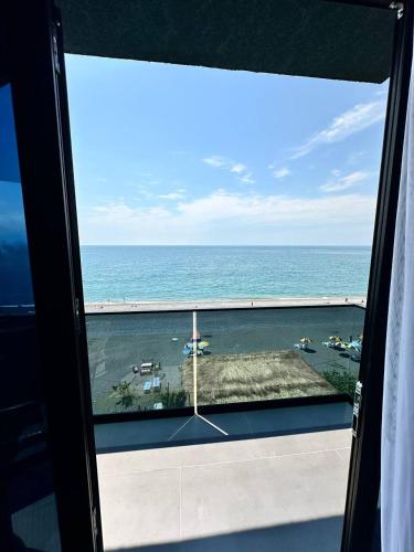 a view of the ocean from a room with a window at Hotel black sea in K'obulet'i