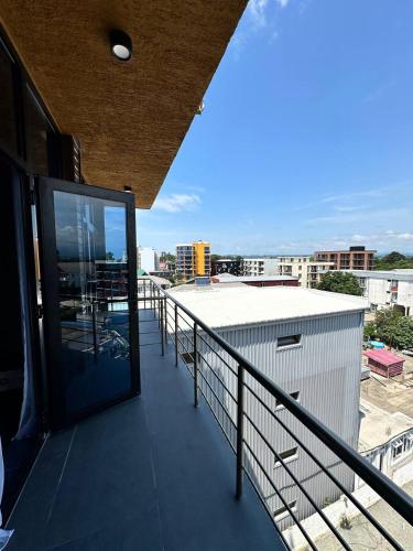 a balcony of a building with a view of a city at Hotel black sea in K'obulet'i