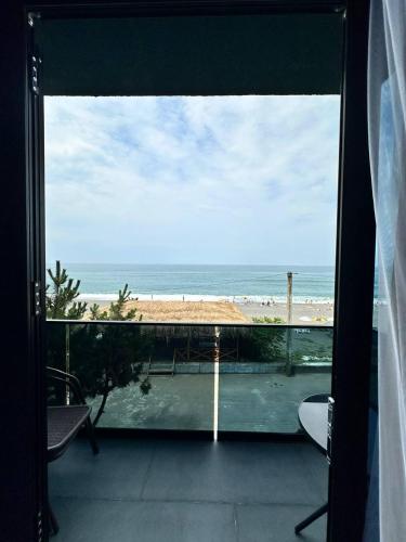 a view of the beach from the balcony of a house at Hotel black sea in K'obulet'i