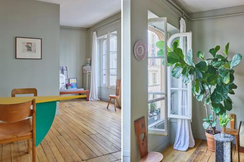 une chambre avec un bureau et une chambre avec des fenêtres dans l'établissement Charming 1BR rue des Martyrs, à Paris