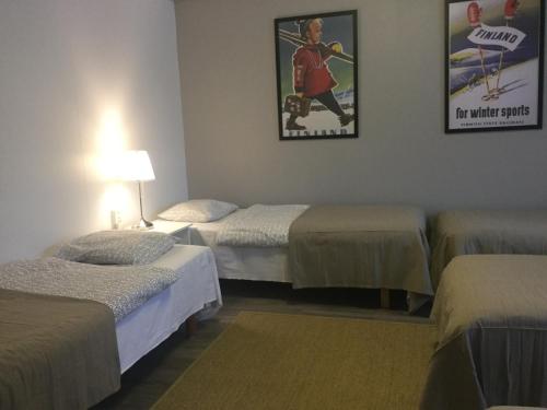 Katil atau katil-katil dalam bilik di Guesthouse Borealis Apartments