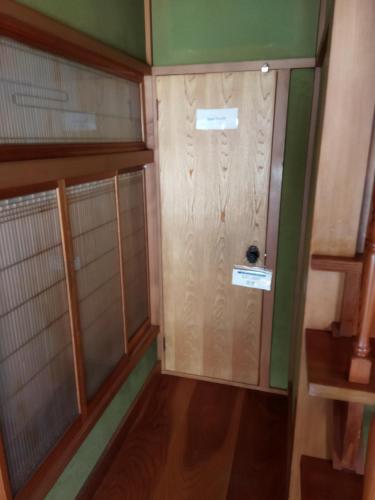 a small room with a door and a wooden floor at Private Room in Ishinomaki, Non-Smoke, Free Parking, Cat Island 2 in Ishinomaki
