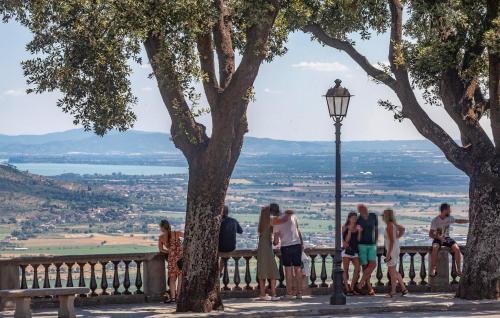 a group of people standing on a bench with a view at Lovely Home In San Pietro A Dame in Poggioni