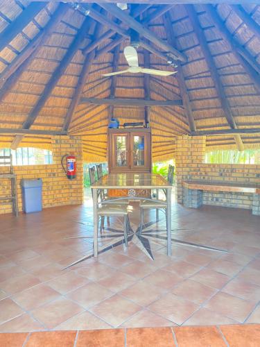 a ping pong table in the middle of a room at The Red room Serengeti sands in Phalaborwa